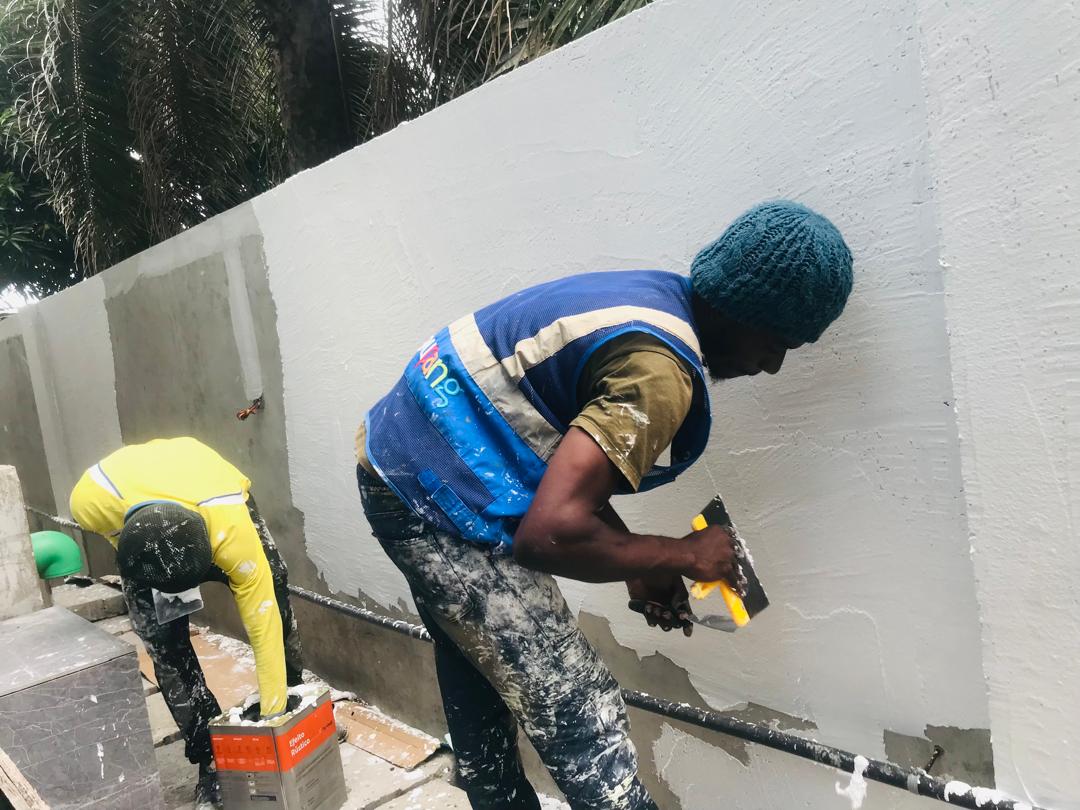 Paintboss worker handling decorative wall finishing